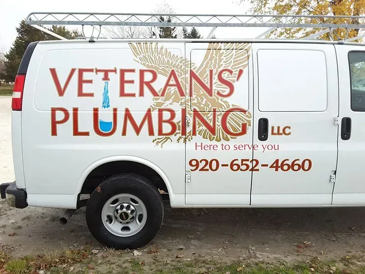 A white van with veterans plumbing written on it