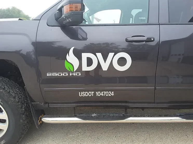 A black truck with the word dvo on the side of it.