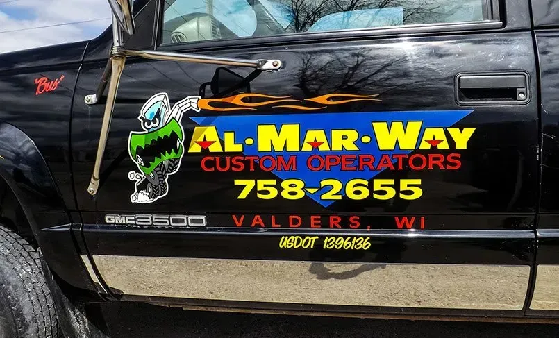 A black truck with al-mar-way custom operators written on the side