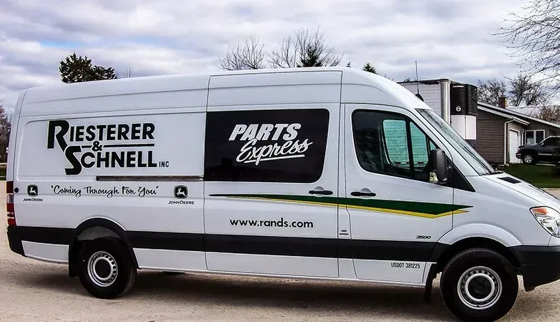 A white van with parts express written on it