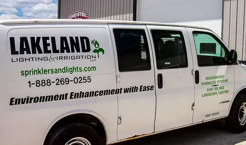 A white van with lakeland lighting and irrigation written on it