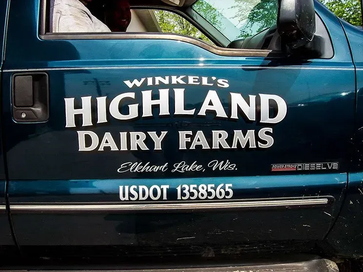A blue truck from winkel 's highland dairy farms