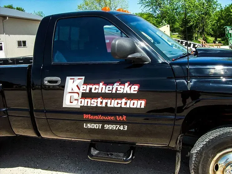 A black truck with kerchefske construction written on the side