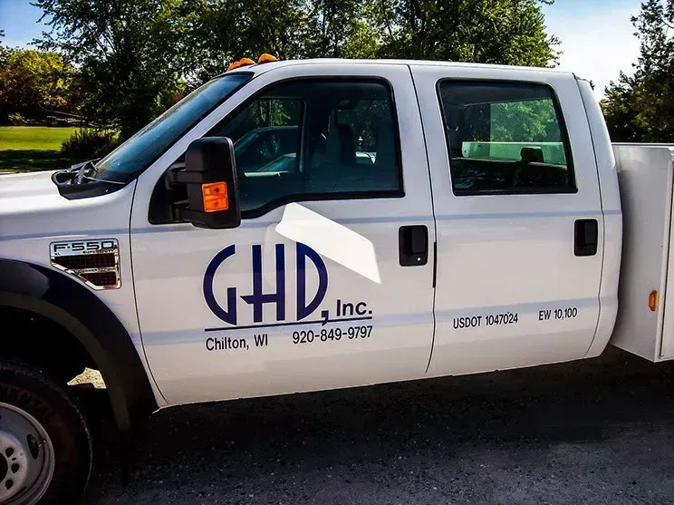 A white truck with the word ghd on the side