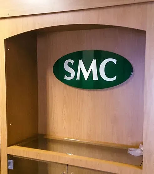 A shelf with a smc logo on it