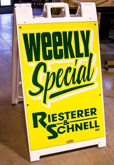 A yellow sign that says weekly special on it