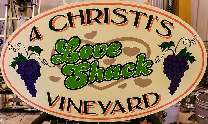 A sign that says a christi 's love shack vineyard