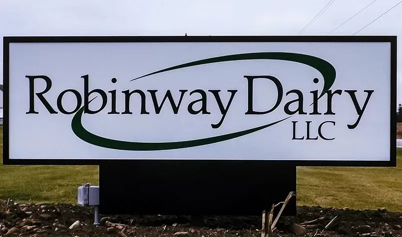 A sign that says robinway dairy llc on it
