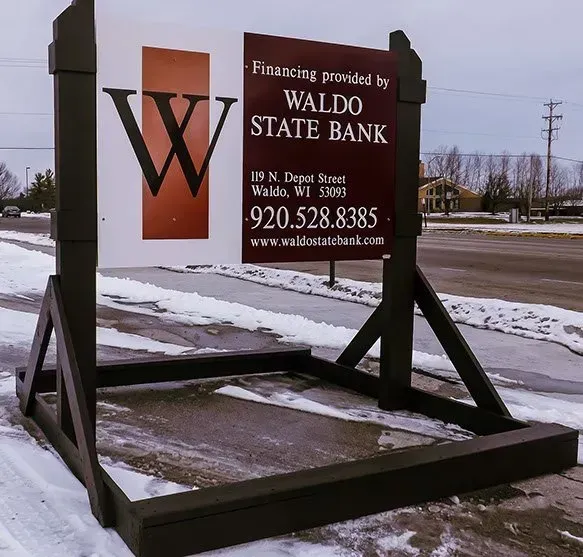 A sign that says waldo state bank on it