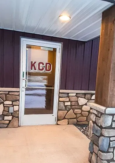 There is a door with the word kcd on it.
