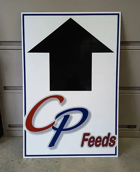 A sign for cp feeds with an arrow pointing up