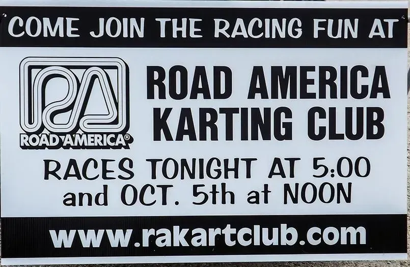 A sign that says come join the racing fun at road america karting club