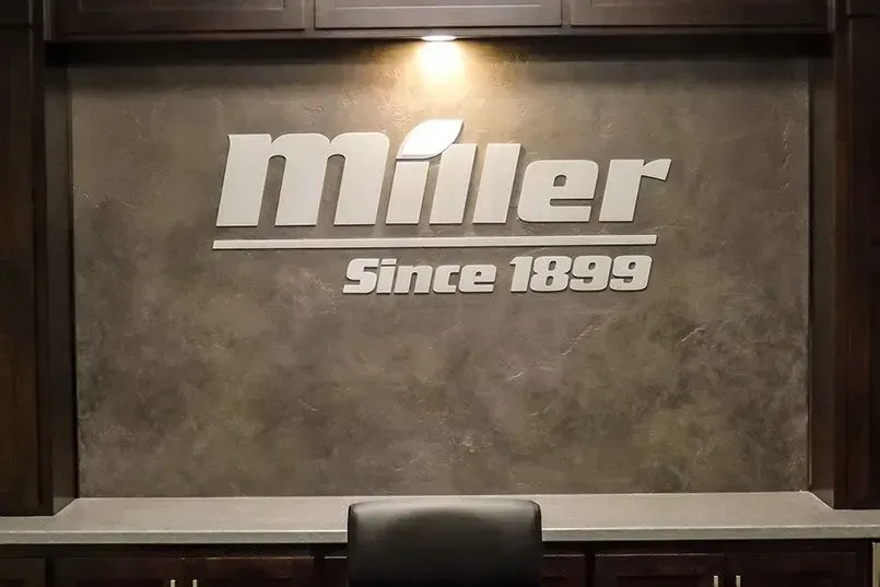 A sign on a wall that says miller since 1899