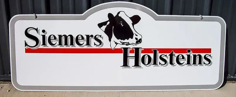 A sign for siemens holsteins with a cow on it