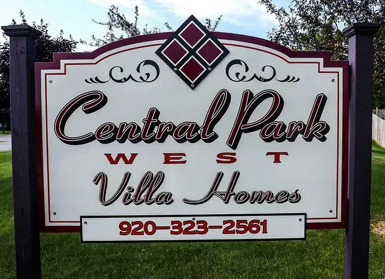 A sign for central park west villa homes