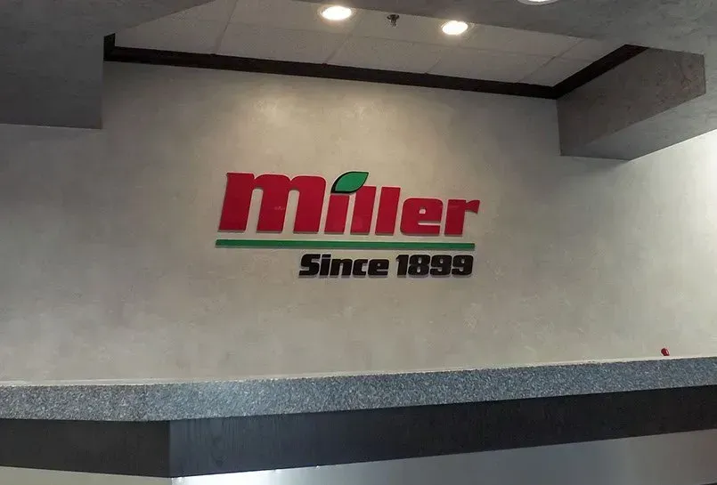A miller sign that is on a wall