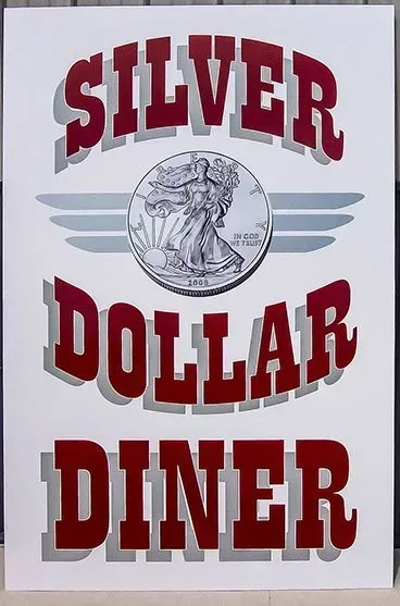A silver dollar diner sign with a liberty coin on it