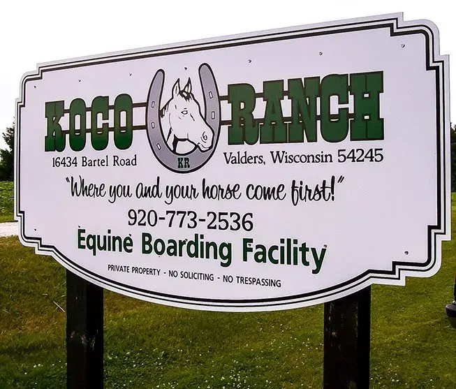 A sign for the coco ranch equine boarding facility