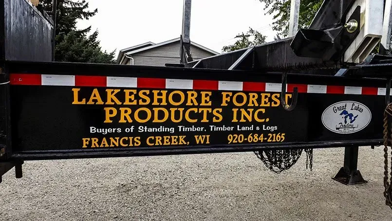 A trailer with a sign that says lakeshore forest products inc.