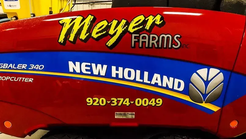 A red meyer farms new holland tractor