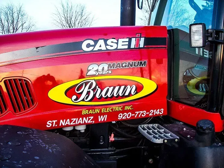 A red case 20 magnum braun tractor is parked in the snow