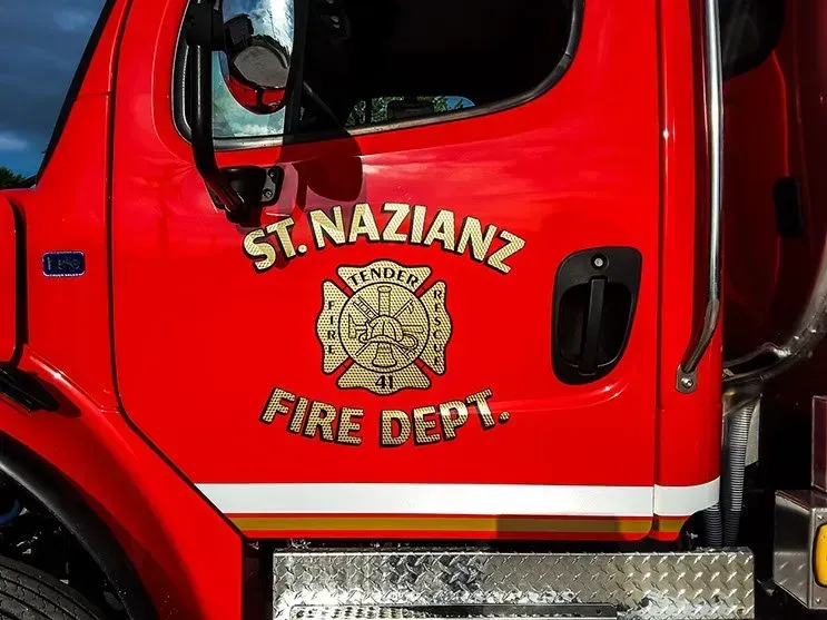 A red fire truck from the st. nazianz fire department