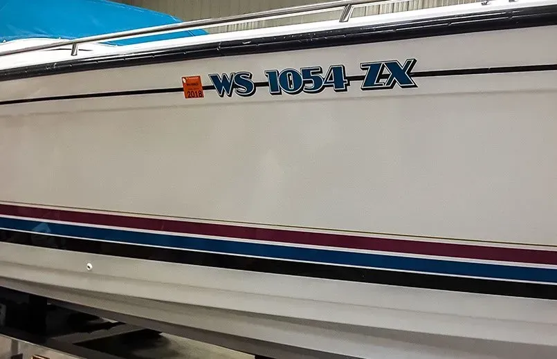A white boat with a license plate that says ws-1055-zx