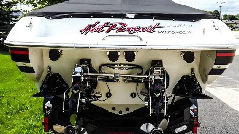 The back of a boat that says hot rod on it