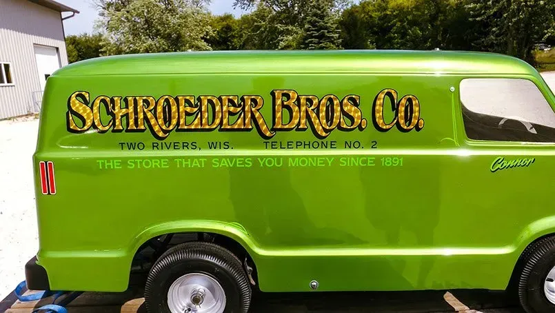 A green van with schroeder bros. co. written on the side