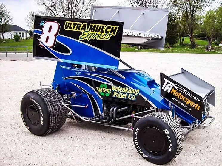 A blue race car with the number 8 on it