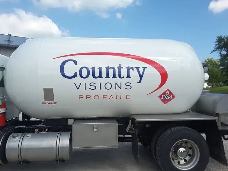 A country visions propane truck is parked on the side of the road