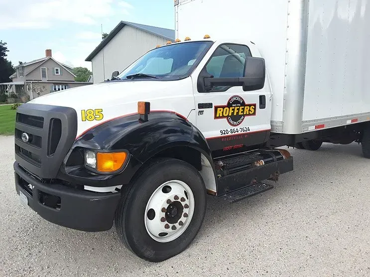 A white truck with the word rotters on the side