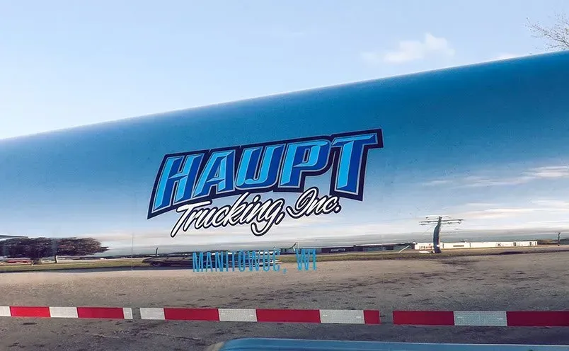 A blue truck with the word haupt on it