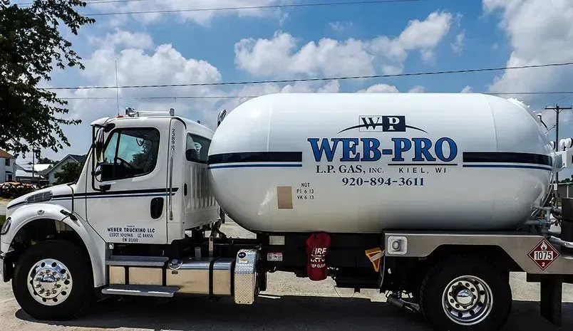 A web-pro propane truck is parked in a parking lot