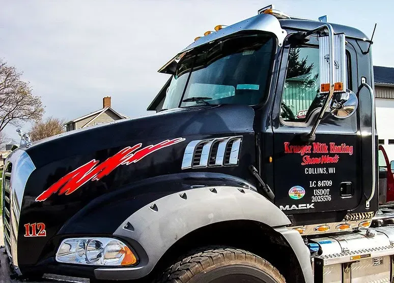 A black truck with the number 102 on the front