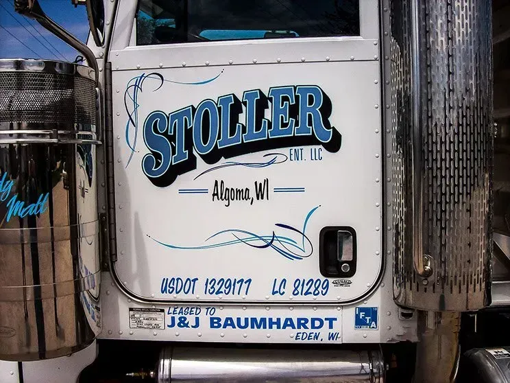 A white truck with the word stoller painted on it