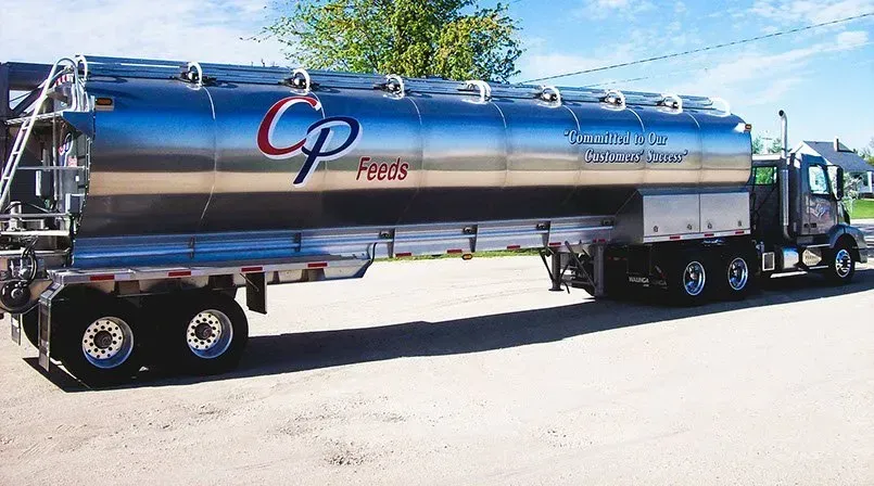 A large tanker truck is parked in a parking lot