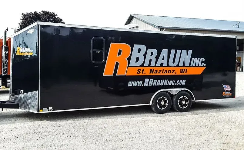 A black trailer with the word braun on it