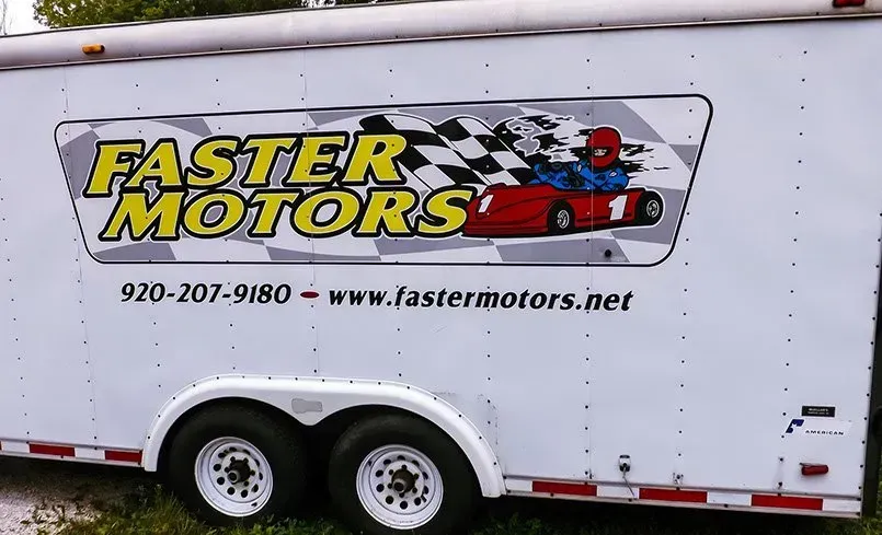 A trailer that says faster motors on it