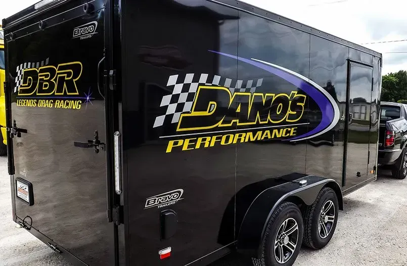 A black trailer with danos performance written on it