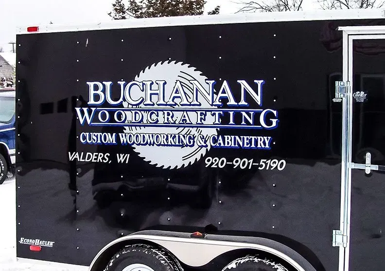A black trailer for buchanan woodworking cabinetry