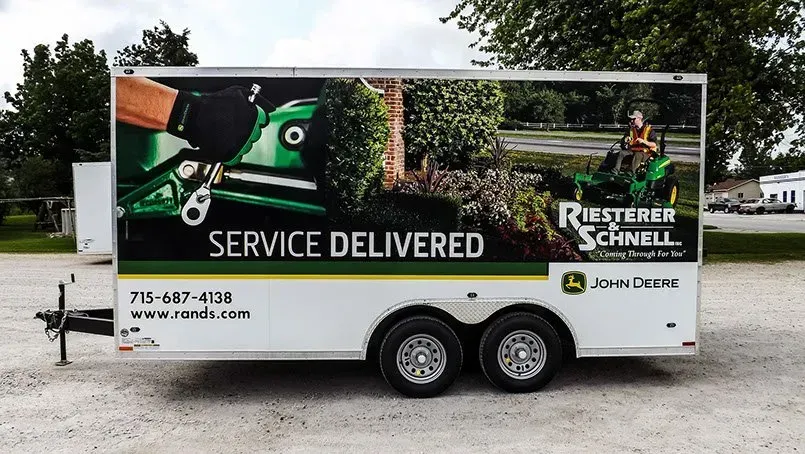 A trailer that says service delivered on it