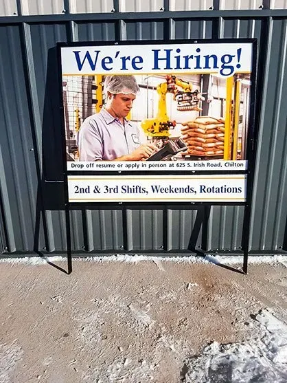A sign that says we 're hiring on it