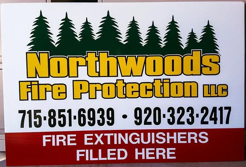 A sign that says northwoods fire protection llc on it
