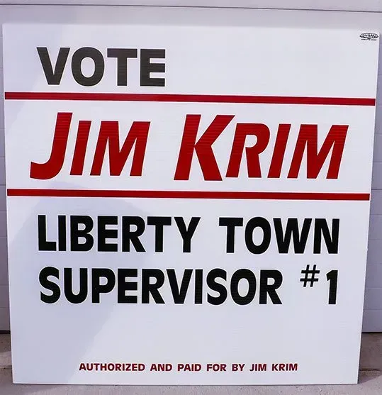 A sign that says vote jim krim liberty town supervisor # 1