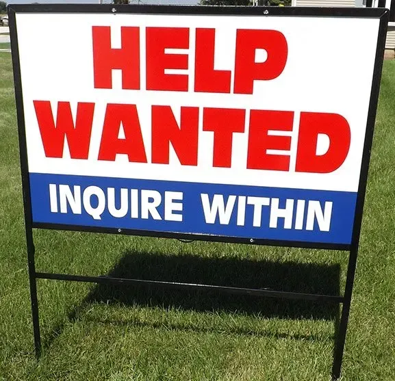 A sign that says help wanted inquire within