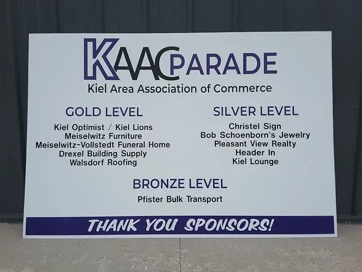 A sign that says kaacparade on it
