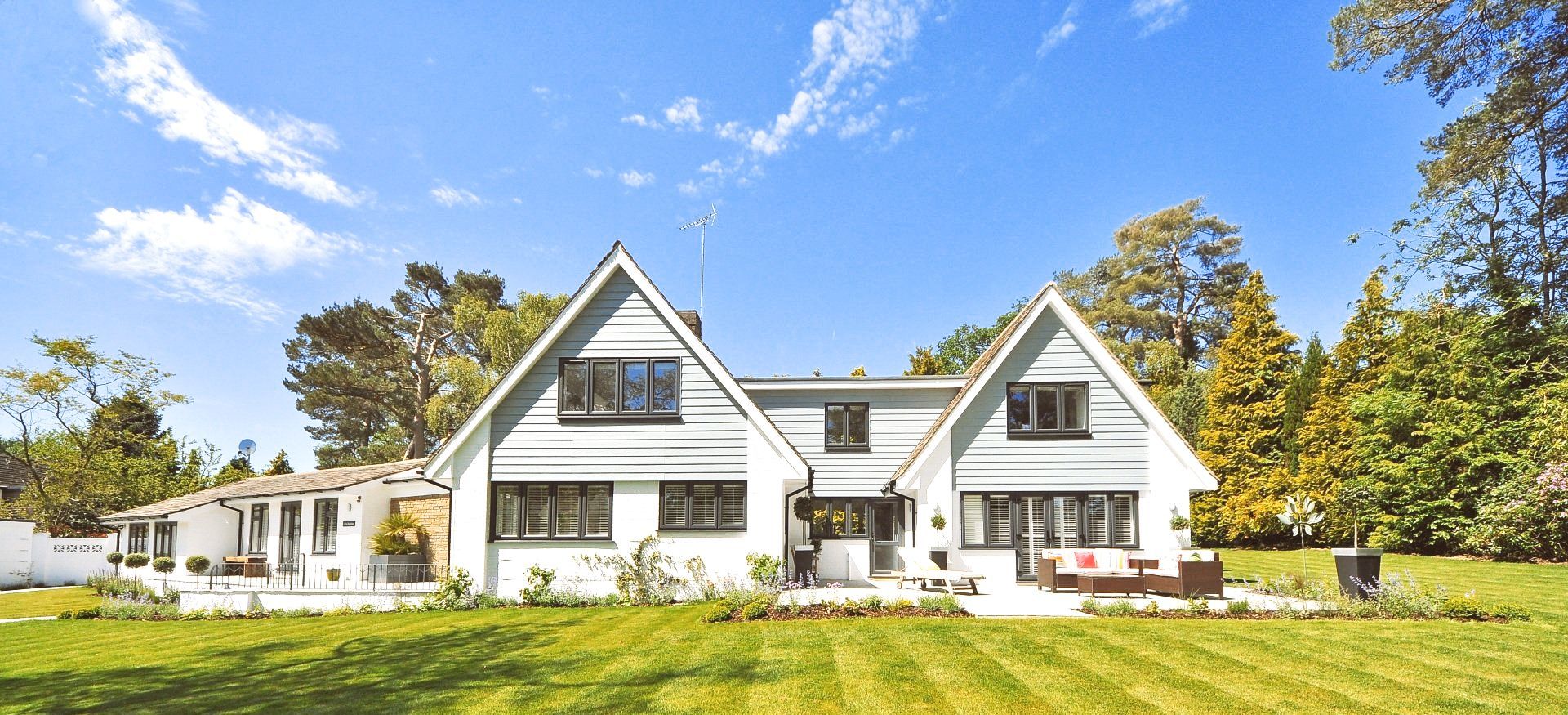 Home insurance policy covering a modern two-story house in North Carolina