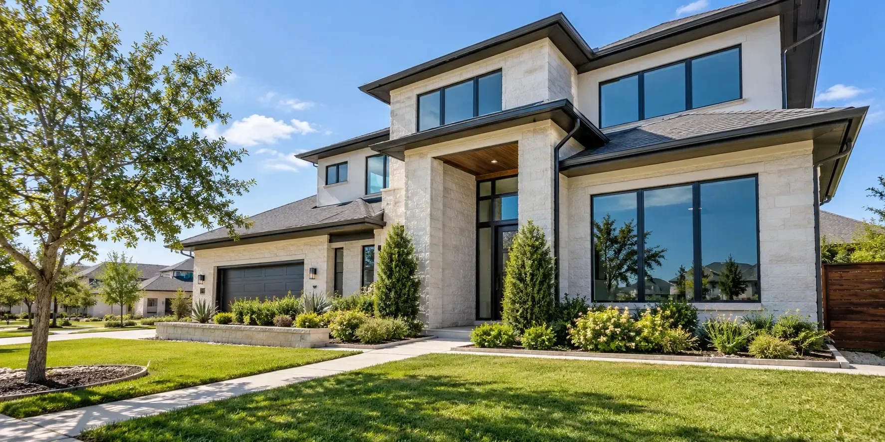 Modern McKinney, Texas home exterior with reflective privacy-tinted windows and landscaped front yard.