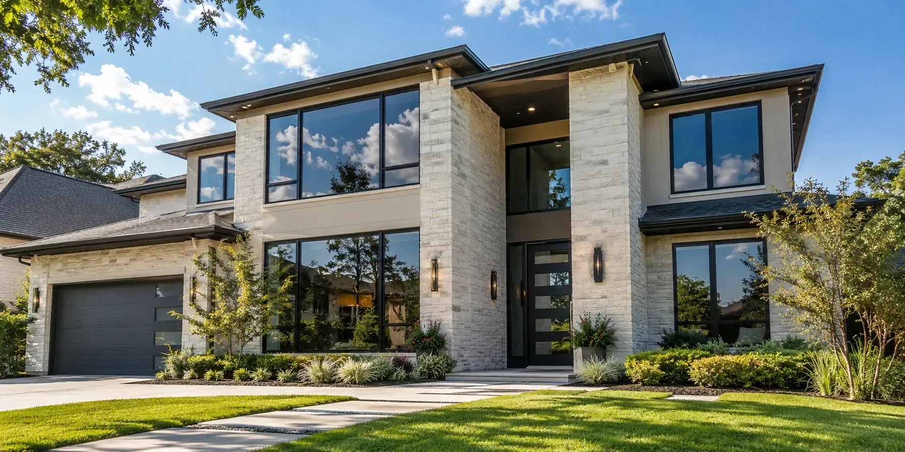 Modern Plano home with freshly tinted windows reflecting a bright blue Texas sky outdoors.